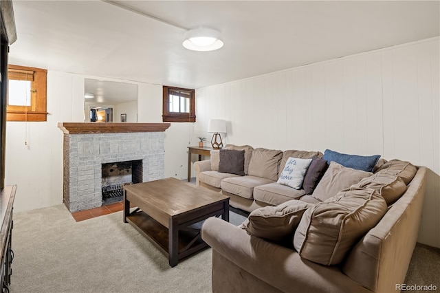 carpeted living area featuring a fireplace