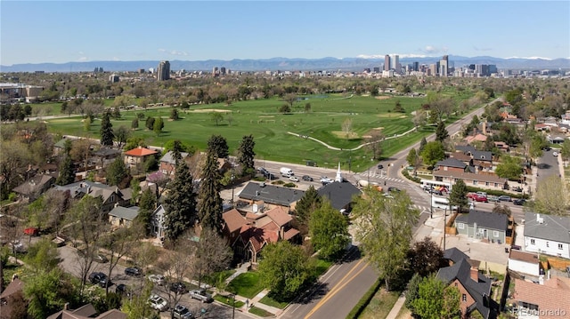 birds eye view of property with a view of city, a residential view, a mountain view, and view of golf course