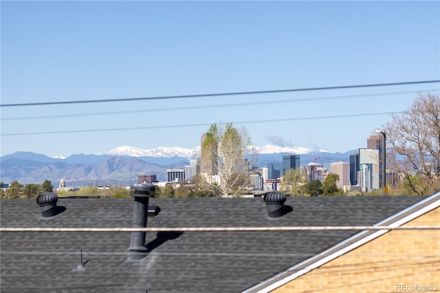 surrounding community with a city view and a mountain view