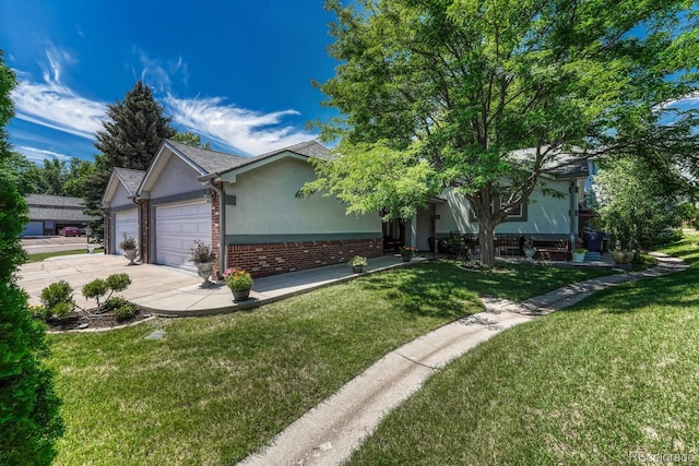 5173 S Emporia Way, Greenwood Village, CO 80111 - view of front facade with stucco siding, an attached garage, a front lawn, and brick siding