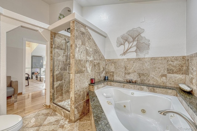 5173 S Emporia Way, Greenwood Village, CO 80111 - bathroom with a stall shower, a tub with jets, and a textured wall