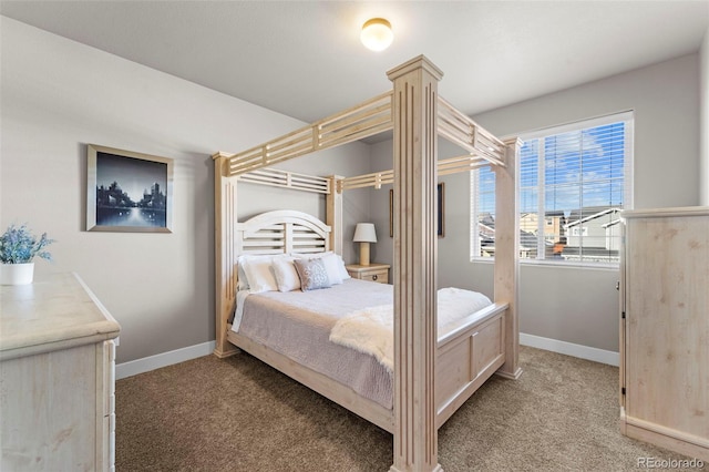 carpeted bedroom featuring decorative columns