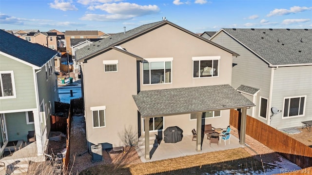 back of house with a patio