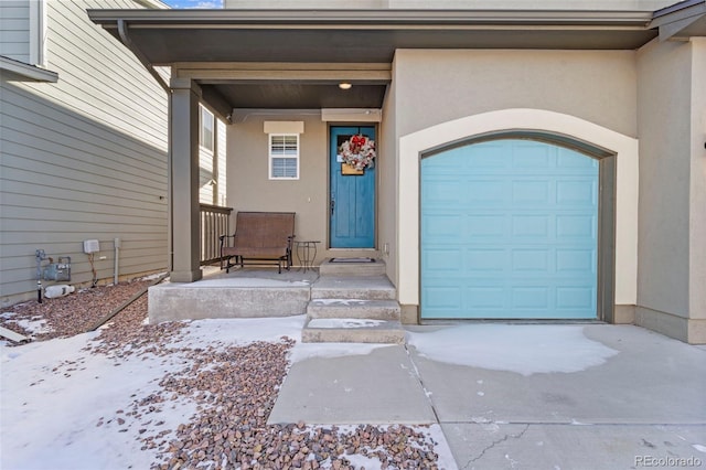 view of snow covered property entrance