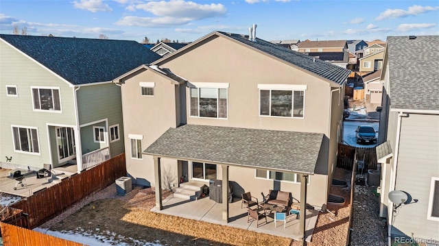 back of property featuring a patio and central air condition unit