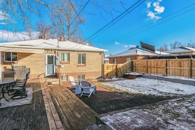 view of snow covered deck