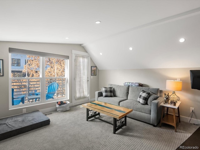 living room with vaulted ceiling and carpet flooring