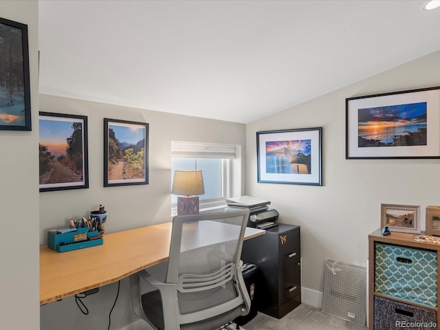 office space featuring carpet flooring and vaulted ceiling