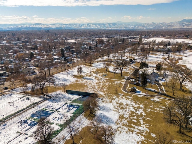 snowy aerial view with a mountain view