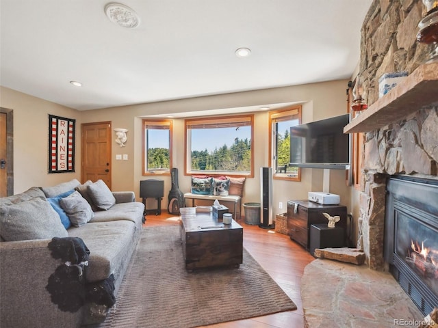 34075 Grouse Ln, Evergreen, CO 80439 - living area featuring a fireplace, light wood finished floors, and recessed lighting