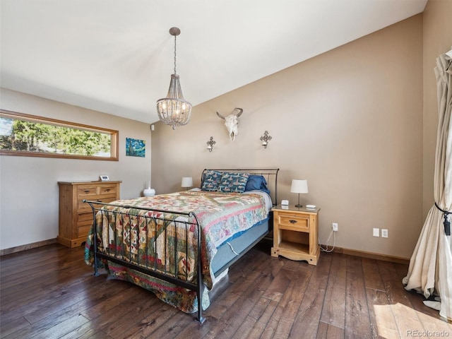 34075 Grouse Ln, Evergreen, CO 80439 - bedroom featuring hardwood / wood-style flooring, a chandelier, and baseboards