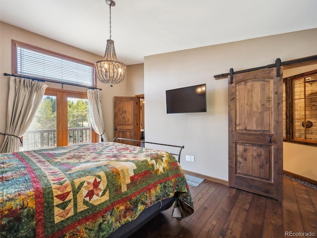 34075 Grouse Ln, Evergreen, CO 80439 - bedroom featuring baseboards, access to outside, dark wood-type flooring, and a chandelier