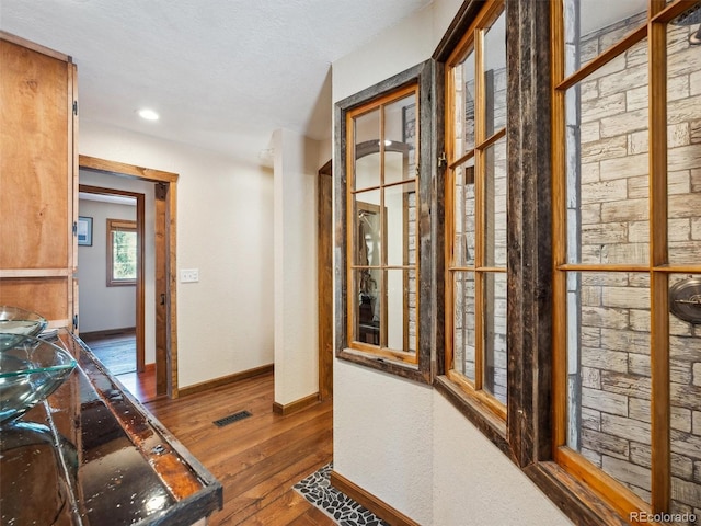 34075 Grouse Ln, Evergreen, CO 80439 - corridor with hardwood / wood-style floors and baseboards