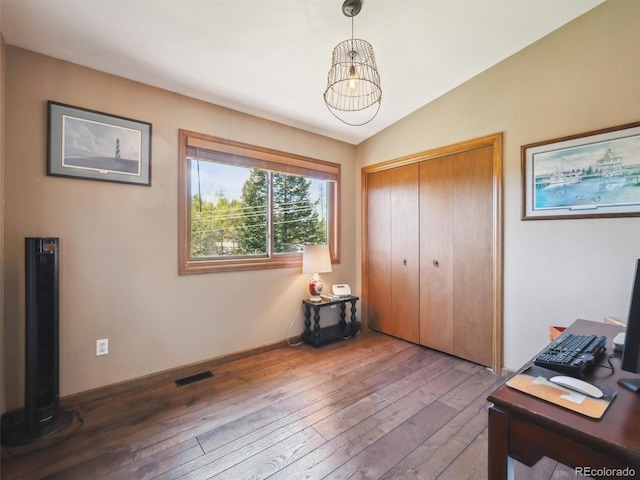 34075 Grouse Ln, Evergreen, CO 80439 - office space with hardwood / wood-style flooring, vaulted ceiling, and a chandelier