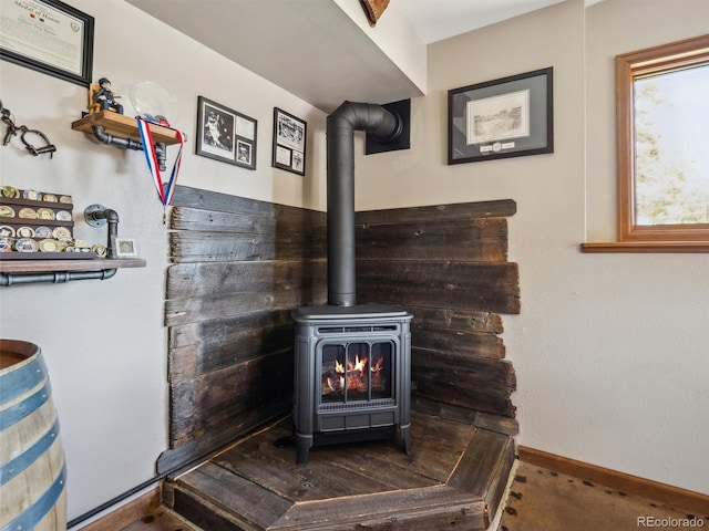 34075 Grouse Ln, Evergreen, CO 80439 - detailed view of a wood stove, baseboards, and carpet
