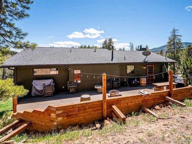 34075 Grouse Ln, Evergreen, CO 80439 - rear view of property featuring roof with shingles and a wooden deck