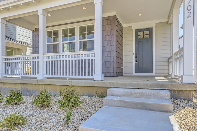 entrance to property featuring a porch