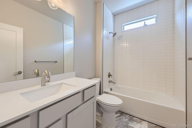 full bathroom with  shower combination, vanity, and toilet