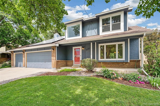 13701 Yank Way, Arvada, CO 80004 - view of front of property featuring driveway, a front lawn, roof mounted solar panels, a garage, and a porch