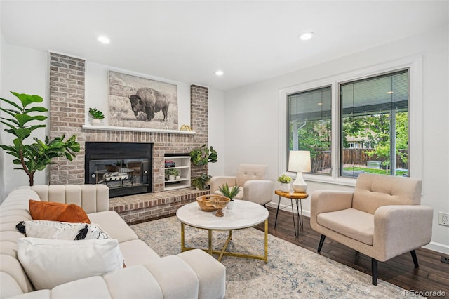 13701 Yank Way, Arvada, CO 80004 - living room with a fireplace, recessed lighting, and wood finished floors