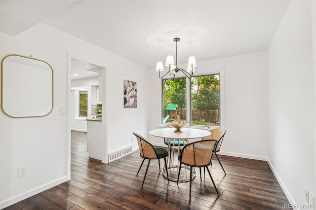 13701 Yank Way, Arvada, CO 80004 - dining area with dark wood-style floors and a chandelier