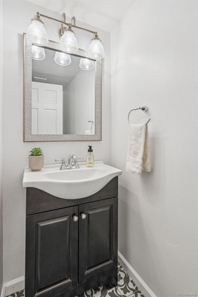 13701 Yank Way, Arvada, CO 80004 - bathroom featuring vanity and baseboards