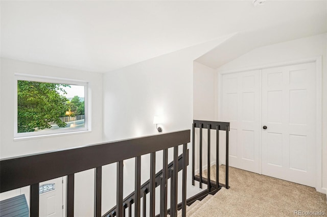 13701 Yank Way, Arvada, CO 80004 - hall featuring light carpet, lofted ceiling, and an upstairs landing