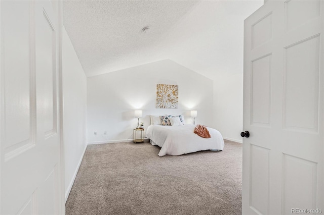 13701 Yank Way, Arvada, CO 80004 - carpeted bedroom featuring vaulted ceiling and a textured ceiling