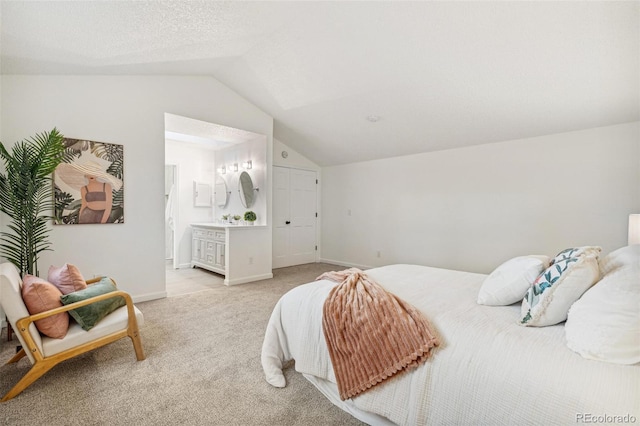13701 Yank Way, Arvada, CO 80004 - bedroom featuring vaulted ceiling, light colored carpet, and ensuite bath