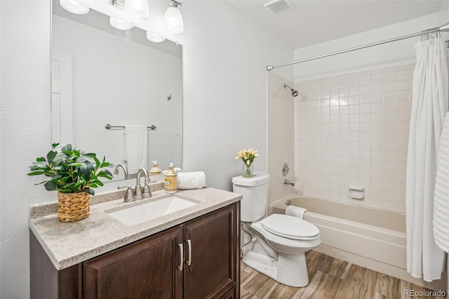 13701 Yank Way, Arvada, CO 80004 - bathroom featuring vanity, wood finished floors, and shower / tub combo