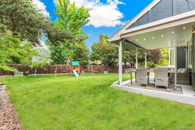 13701 Yank Way, Arvada, CO 80004 - fenced backyard featuring a playground and a patio area
