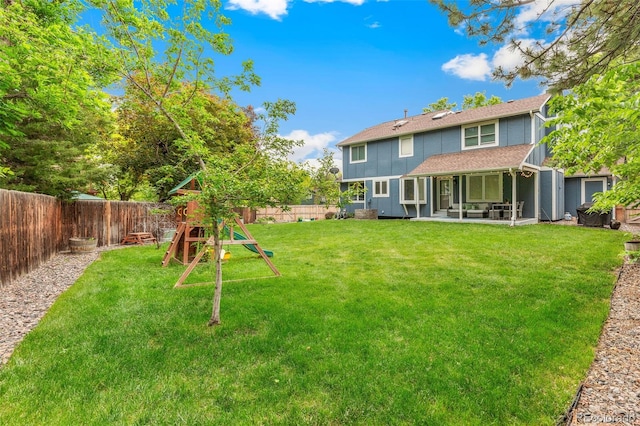13701 Yank Way, Arvada, CO 80004 - fenced backyard with a playground and a patio