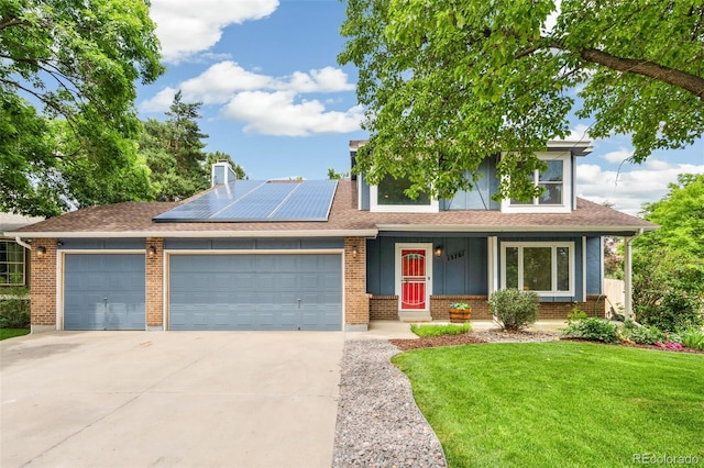13701 Yank Way, Arvada, CO 80004 - view of front facade with a garage, driveway, a front lawn, roof mounted solar panels, and covered porch