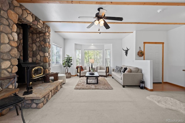 7551 Remington Rd, Como, CO 80432 - carpeted living area with a wood stove and ceiling fan