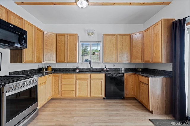 7551 Remington Rd, Como, CO 80432 - kitchen with black appliances, light wood-style flooring, and dark stone countertops