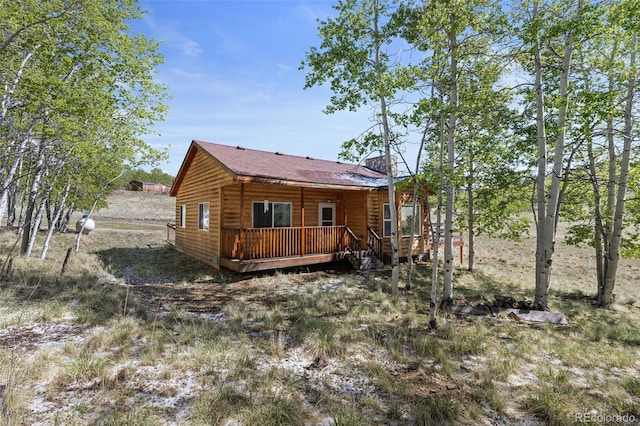 7551 Remington Rd, Como, CO 80432 - back of house featuring a wooden deck and log veneer siding