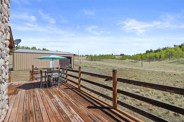 7551 Remington Rd, Como, CO 80432 - wooden deck with a view of rural / pastoral area and outdoor dining area