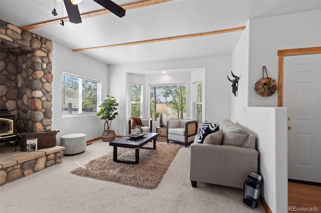 7551 Remington Rd, Como, CO 80432 - carpeted living area featuring a wood stove and ceiling fan