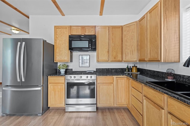 7551 Remington Rd, Como, CO 80432 - kitchen with stainless steel appliances, light wood-style floors, and dark stone countertops
