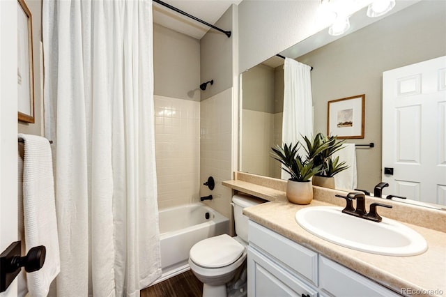 4968 Montvale Dr, Highlands Ranch, CO 80130 - full bath featuring toilet, wood finished floors, vanity, and shower / tub combo with curtain