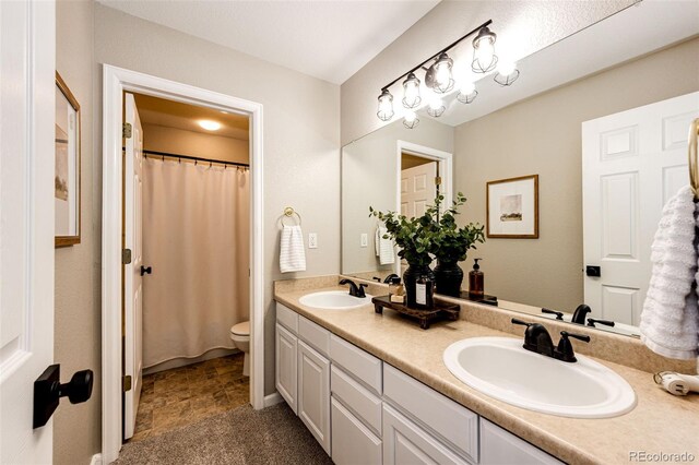 4968 Montvale Dr, Highlands Ranch, CO 80130 - full bath with toilet, double vanity, a sink, and a shower with curtain