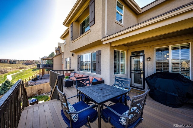 4968 Montvale Dr, Highlands Ranch, CO 80130 - wooden deck with grilling area and outdoor dining space