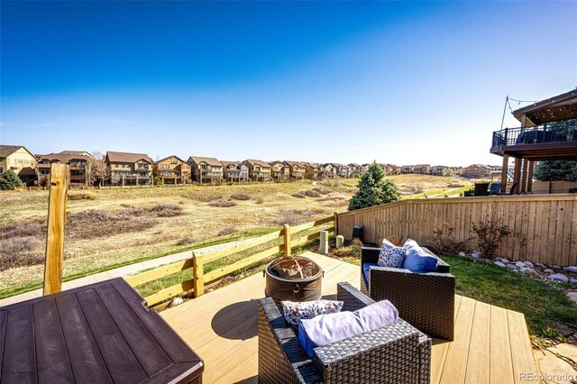 4968 Montvale Dr, Highlands Ranch, CO 80130 - wooden terrace featuring fence, an outdoor fire pit, and a residential view