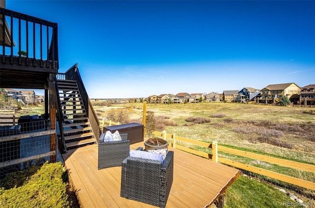 4968 Montvale Dr, Highlands Ranch, CO 80130 - wooden deck with stairs, a fire pit, and a residential view