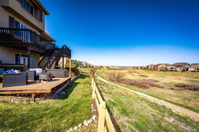 4968 Montvale Dr, Highlands Ranch, CO 80130 - view of yard featuring a wooden deck and stairs