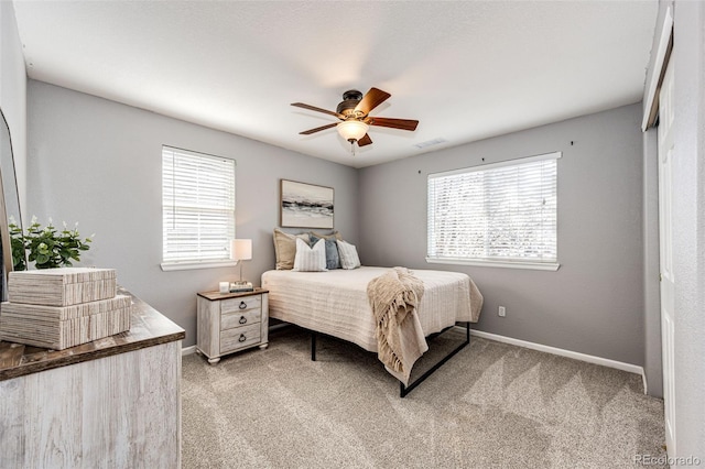 4968 Montvale Dr, Highlands Ranch, CO 80130 - bedroom with carpet flooring, visible vents, and multiple windows
