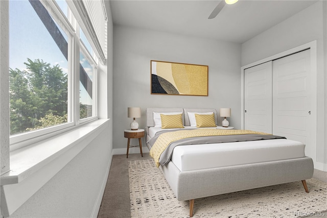5988 N Boston St, Denver, CO 80238 - bedroom featuring carpet floors, a closet, and ceiling fan