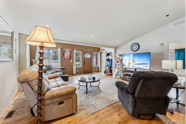 living area with vaulted ceiling, light wood finished floors, recessed lighting, and baseboards