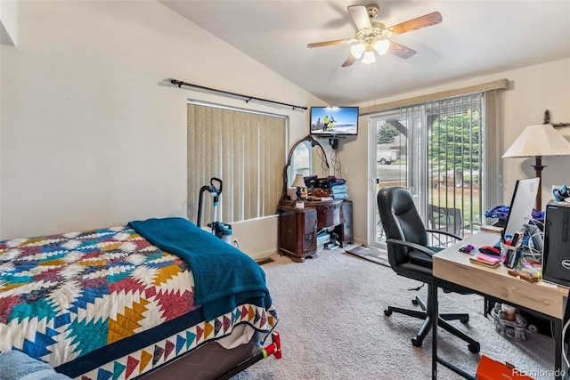 carpeted bedroom featuring vaulted ceiling, access to outside, a desk, and a ceiling fan