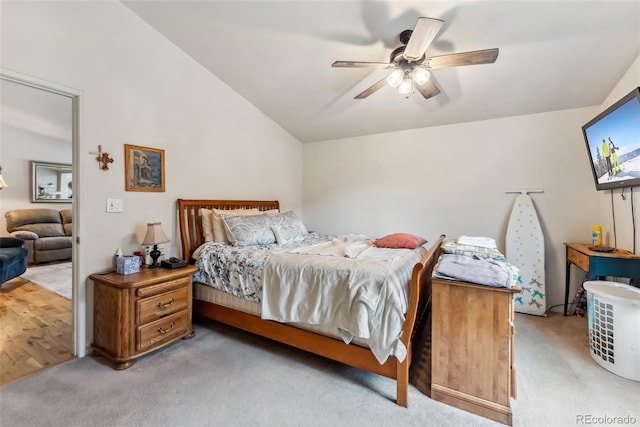 carpeted bedroom with lofted ceiling and a ceiling fan